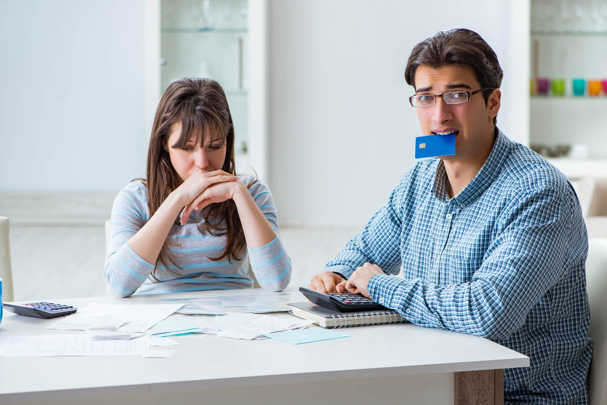 A worried couple who needs free credit counseling