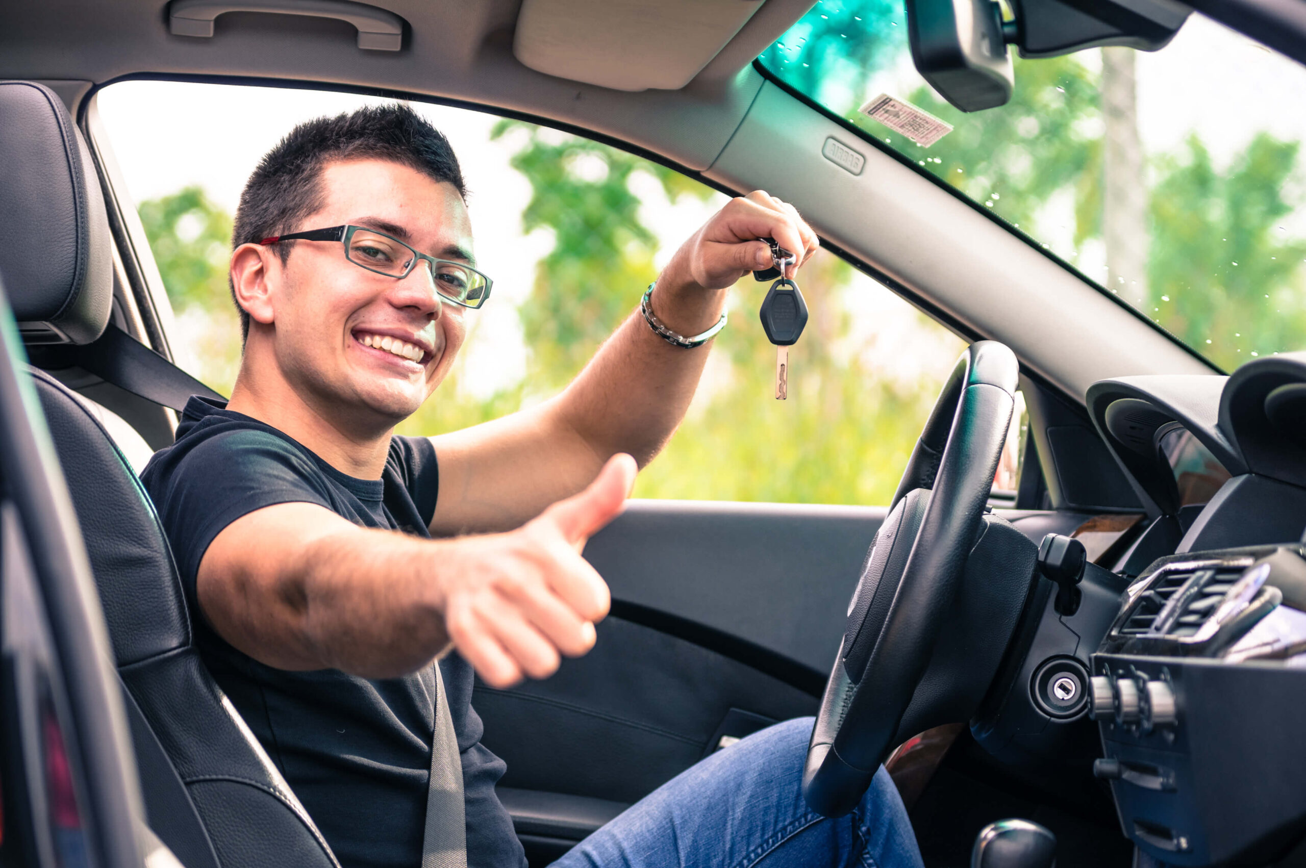 man giving a thumbs up sign after Nonprofit Credit Counseling helped him qualify for a car loan