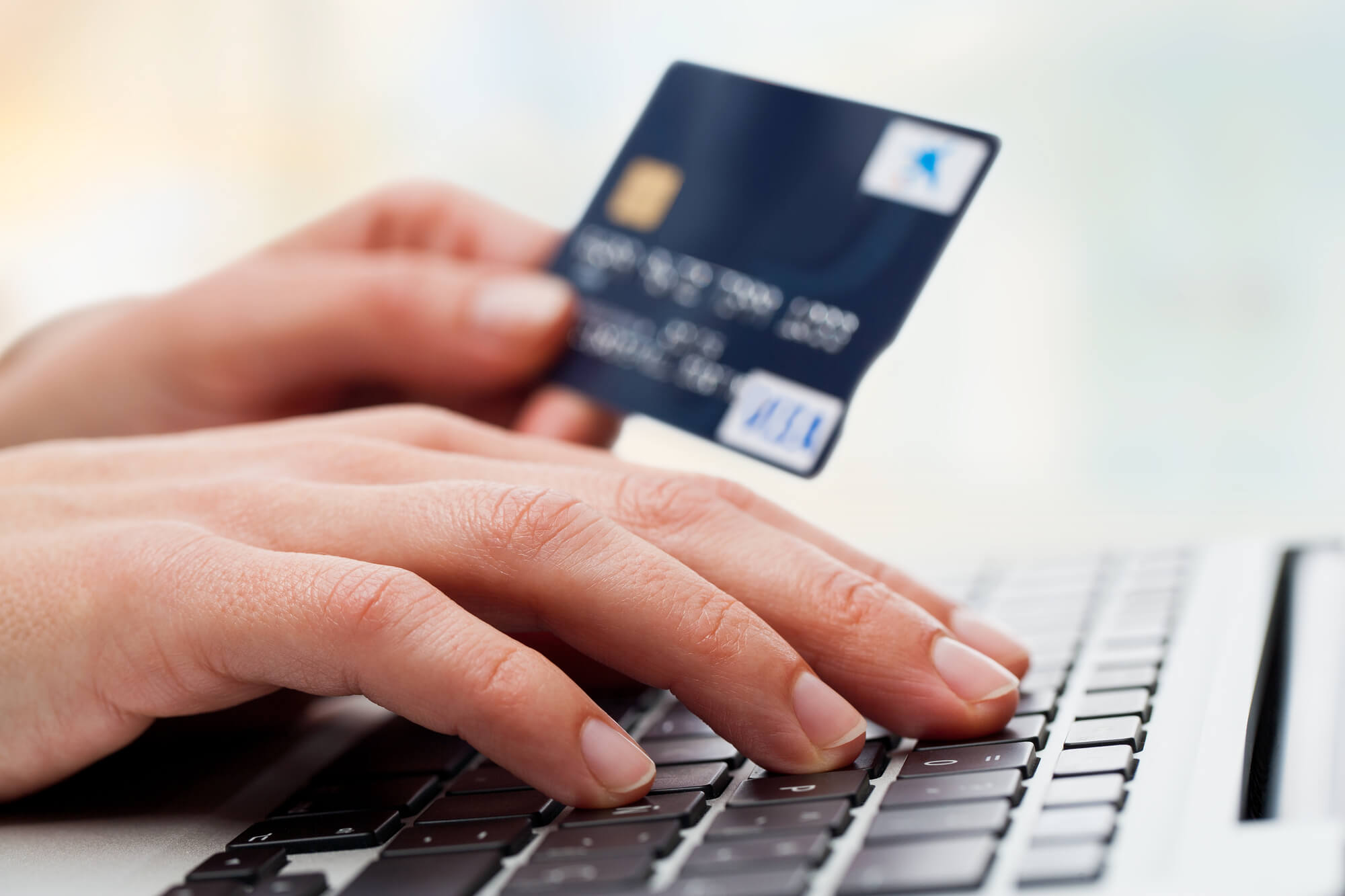 a woman making a purchase with her credit card and needing Payday Loan Debt Consolidation