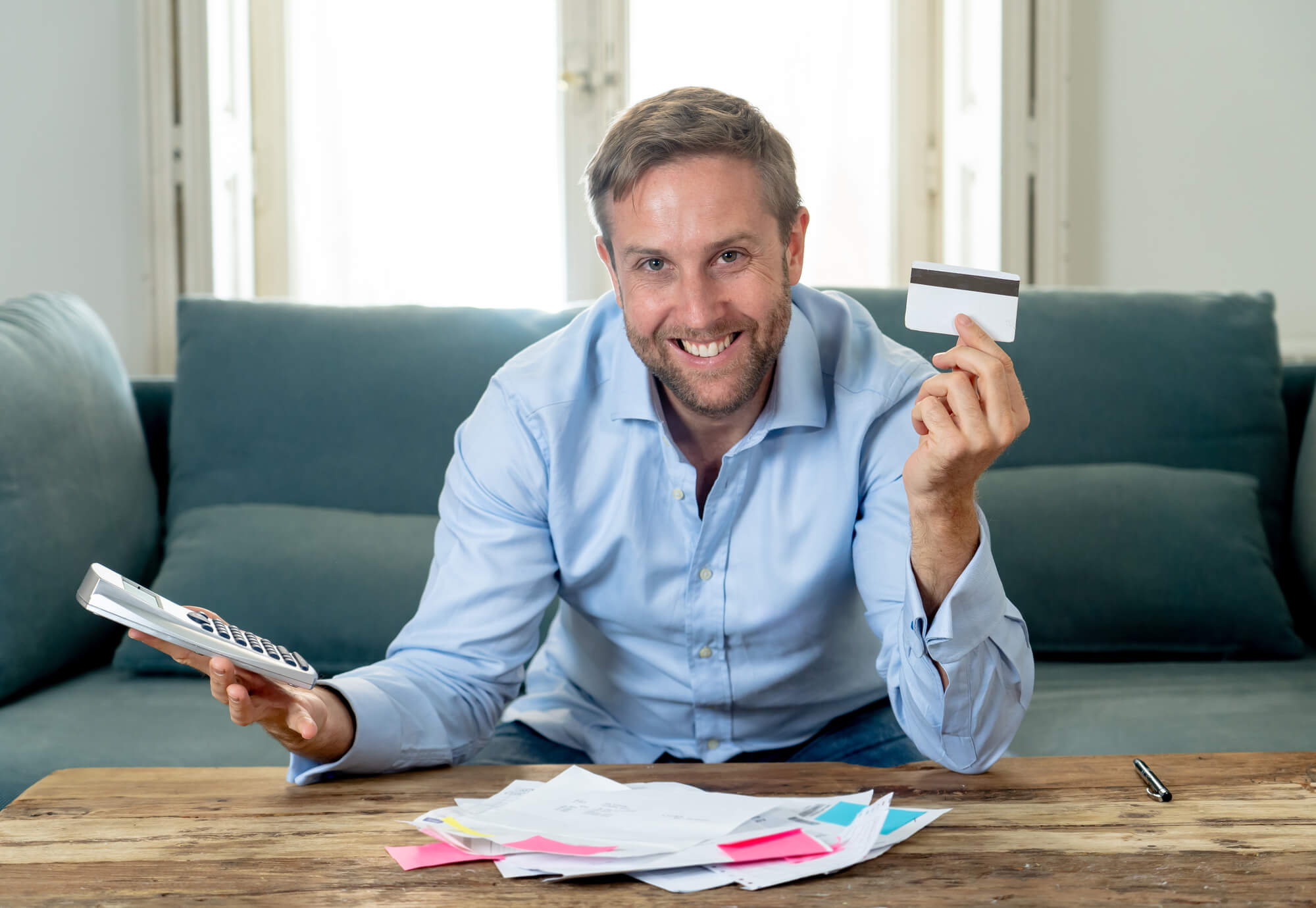 man-smiling-after-getting-help-with-credit-card-debt